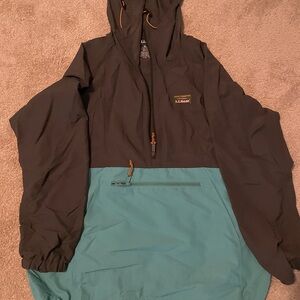 LL Bean wind breaker in color block of gray and blue, size XL regular.